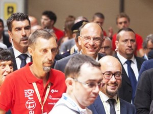 Il presidente del Consiglio, Enrico Letta, accompagnato da Emilia Guarnieri, arriva all'edizione 2013 del Meeting di Cl a Rimini,18 agosto 2013. ANSA/PASQUALE BOVE