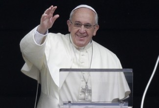 Pope Francis waves as he arrives to lead Angelus in in St. Peter's Square