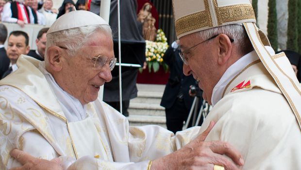 ALTERNATIVE CROP - This handout picture released on April 27, 2014 by the Vatican press office shows Pope Francis (R) meeting with Pope emeritus Benedict XVI during the canonisation mass of Popes John XXIII and John Paul II on St Peter's square at the Vatican on April 27, 2014. Catholics from around the world gathered in Rome on Sunday for a mass presided by Pope Francis to confer sainthood on John Paul II and John XXIII -- two influential popes who helped shape 20th century history. AFP PHOTO / OSSERVATORE ROMANO/HO RESTRICTED TO EDITORIAL USE - MANDATORY CREDIT "AFP PHOTO / OSSERVATORE ROMANO" - NO MARKETING NO ADVERTISING CAMPAIGNS - DISTRIBUTED AS A SERVICE TO CLIENTS