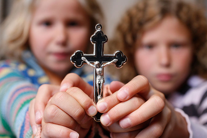 Children holding a crucifix, Haute Savoie, France