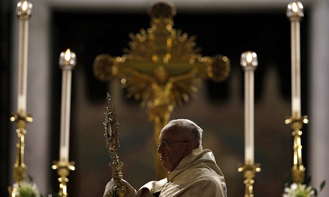 Pope Francis holds a monstrance containing a Holy Host at the end of the Corpus Domini procession from St. John at the Lateran Basilica to St. Mary Major Basilica to mark the feast of the Body and Blood of Christ, in Rome, Thursday, Italy, Thursday, June 4, 2015. The event is dedicated to the mystery of the Eucharist and concludes the cycle of feasts following Easter. (AP Photo/Gregorio Borgia) ORG XMIT: GB105