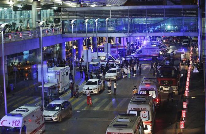 Security and rescue personnel gather outside Istanbul's Ataturk airport, early Wednesday, June 28, 2016. Two explosions have rocked Istanbul's Ataturk airport Tuesday, killing several people and wounding scores of others, Turkey's justice minister and another official said. A Turkish official says two attackers have blown themselves up at the airport after police fired at them. The official said the attackers detonated the explosives at the entrance of the international terminal before entering the x-ray security check. Turkish authorities have banned distribution of images relating to the Ataturk airport attack within Turkey. (ANSA/AP Photo/Emrah Gurel) TURKEY OUT