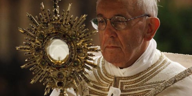 Pope Francis carries a monstrance holding the Blessed Sacrament during the Corpus Christi observance May 30 in Rome. (CNS photo/Paul Haring) (May 30, 2013) See POPE-CORPUSCHRISTI May 30, 2013.
