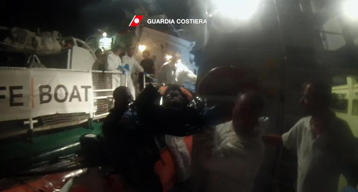 A handout frame video provided on 05 October 2016 and released on 04 October by the Italian Coast Guard shows migrants during a rescue operation conducted by Boats CP302 and CP322 near Lampedusa. Boats saved more than 300 migrants boarding them on 4 rubbers dinghy. ANSA/ ITALIAN COAST GUARD PRESS OFFICE +++ANSA PROVIDES ACCESS TO THIS HANDOUT PHOTO TO BE USED SOLELY TO ILLUSTRATE NEWS REPORTING OR COMMENTARY ON THE FACTS OR EVENTS DEPICTED IN THIS IMAGE; NO ARCHIVING; NO LICENSING+++