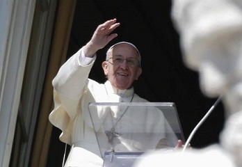 Pope Francis waves as he leads Angelus at Vatican