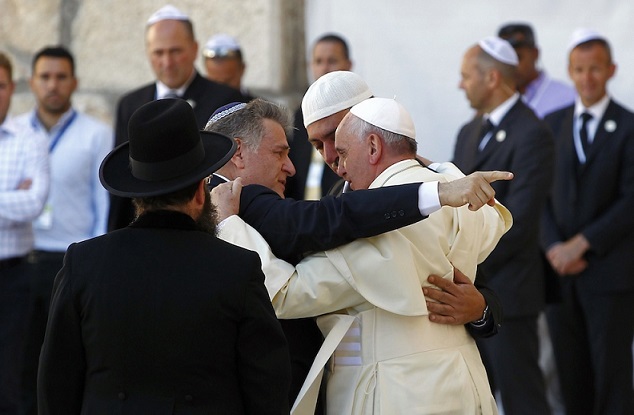 Pope Francis hugs Rabbi Skorka and Abboud, during his visit to the Western Wall in Jerusalem's Old City
